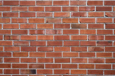 Kırmızı tuğla duvar desenli arka plan. Grafiti yazıları için harika..