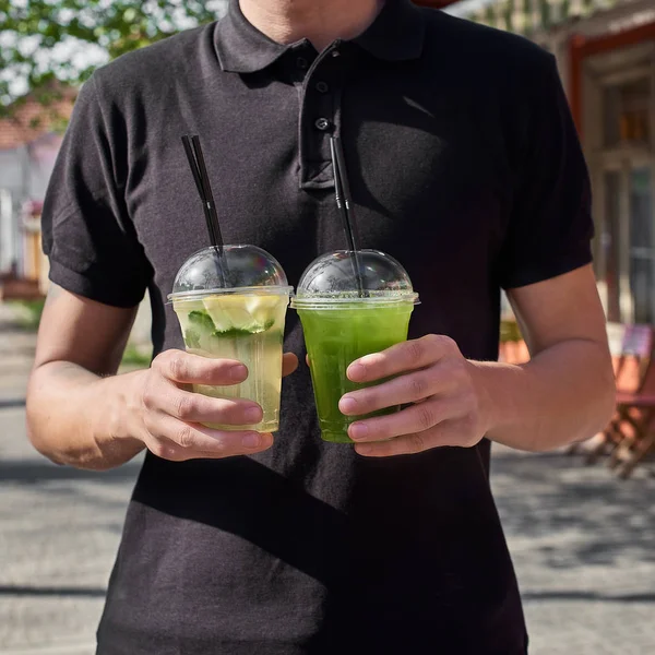 Two Lemonade Hands Man Fresh Cucumber Lemon Drinks Close — Stock Photo, Image