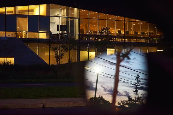 Montreal, Quebec, Canada, September 26, 2018: Sunset clouds reflected in the windows of a modern office building. end of workday in offices — Stock Photo, Image