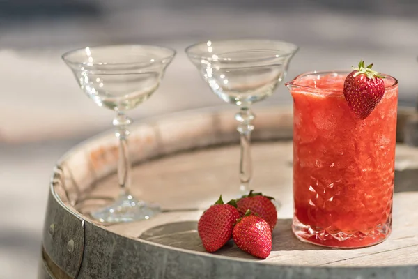 Summer Slushy made from strawberries, smoothies, ice with some ingredients nearby over wooden background — Stockfoto