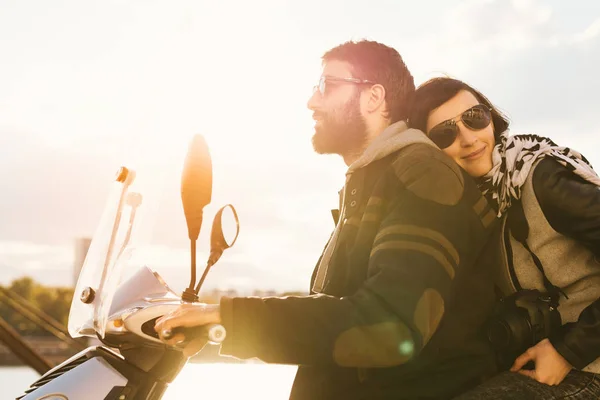 Young couple riding motorcycle