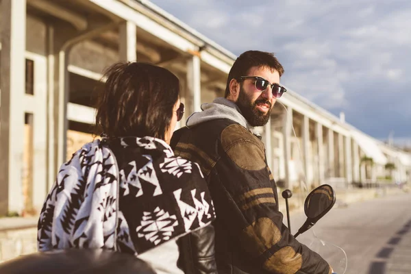 Young couple riding motorcycle