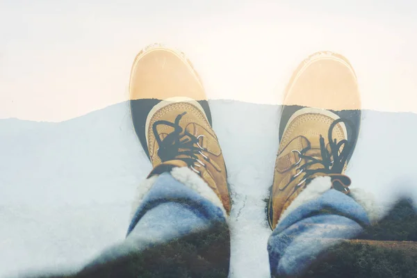 Winter boots in snow, photographer\'s perspective - Image