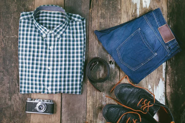 top view on man clothes on the wooden floor flat lay