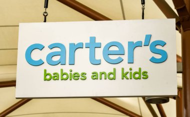 SEATTLE, WA, USA - JUNE 2018: Close up view of a sign outside the Carter's babies and kids store at the Premium Outlets shopping mall in Tulalip near Seattle. clipart