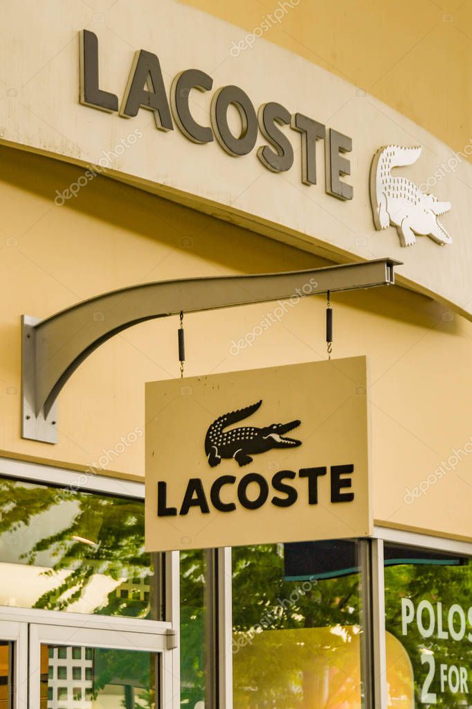 SEATTLE, WA, USA - JUNE 2018: Close up view of a sign outside the Lacoste factory store at the Premium Outlets shopping mall in Tulalip near Seattle.