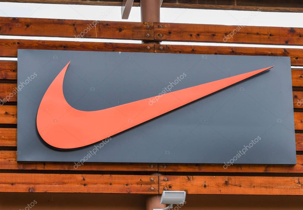 SEATTLE, WA, USA - JUNE 2018: Close up view of a sign outside the Nike factory store at the Premium Outlets shopping mall in Tulalip near Seattle.