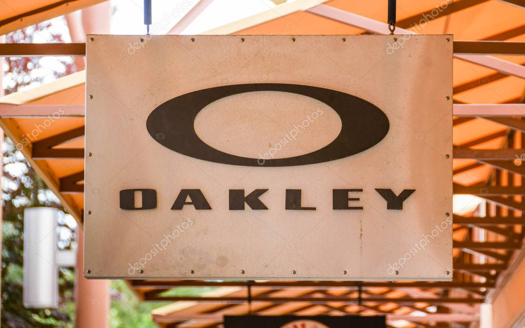 SEATTLE, WA, USA - JUNE 2018: Close up view of a sign outside the Oakley factory store at the Premium Outlets shopping mall in Tulalip near Seattle.