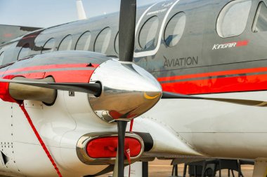 fairFORD, ENGLAND - JULY 2018: Close up view of the engine and propellor blades of a Raytheon Textron Aviaition King Air 350 turboprop aircraft clipart
