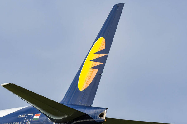 LONDON, ENGLAND - NOVEMBER 2018: Tail fin of a Jet Airways Boeing 777 airliner at London Heathrow Airport.