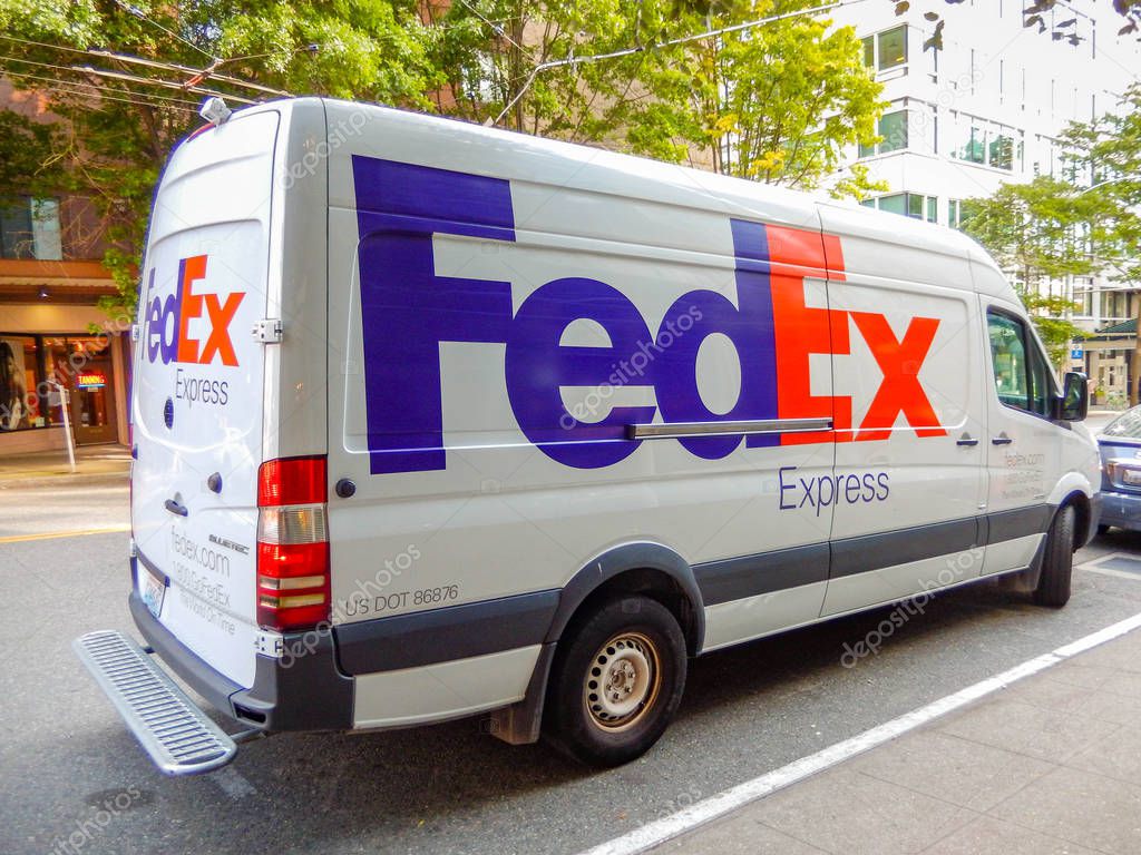 SEATTLE, WA, USA - JUNE 2018: FedEx delivery van parked on a street in Seattle city centre.
