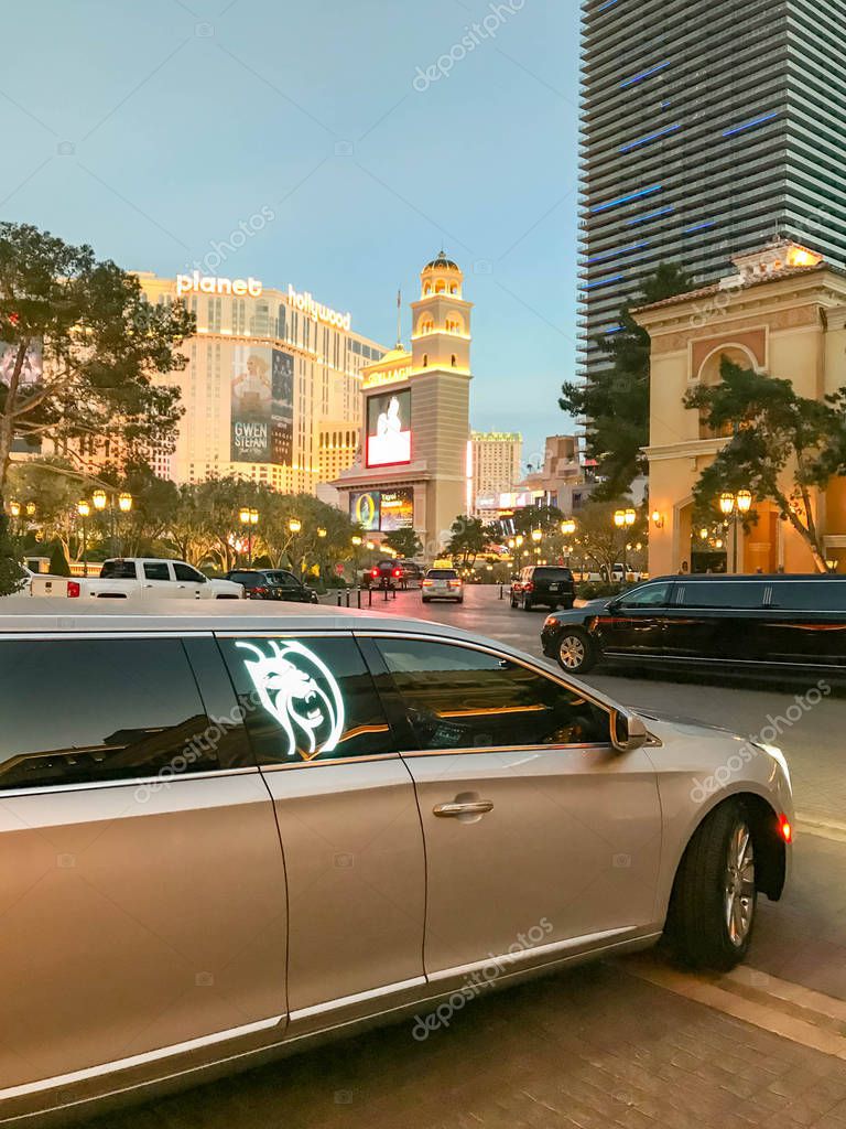 LAS VEGAS, NEVADA, USA - FEBRUARY 2019: Stretched limousine leaving the entrance of The Bellagio Hotel on Las Vegas Boulevard, which is also known as the Las Vegas Strip.
