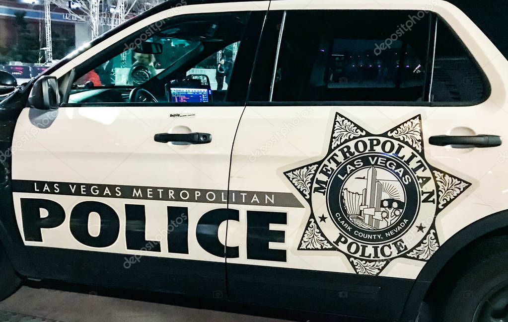 LAS VEGAS, NEVADA, USA - FEBRUARY 2019: Close up view of the side of a police patrol vehicle of the Las Vegas Metropolitan Police at night.