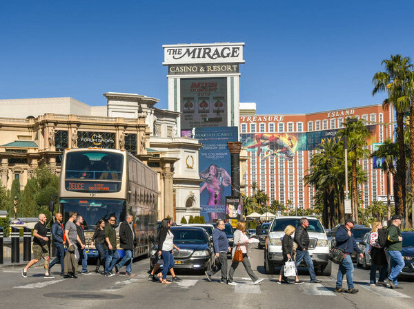 LAS VEGAS, NEVADA, USA - FEBRUARY 2019: People crossing the road on Las Vegas Boulevard.
