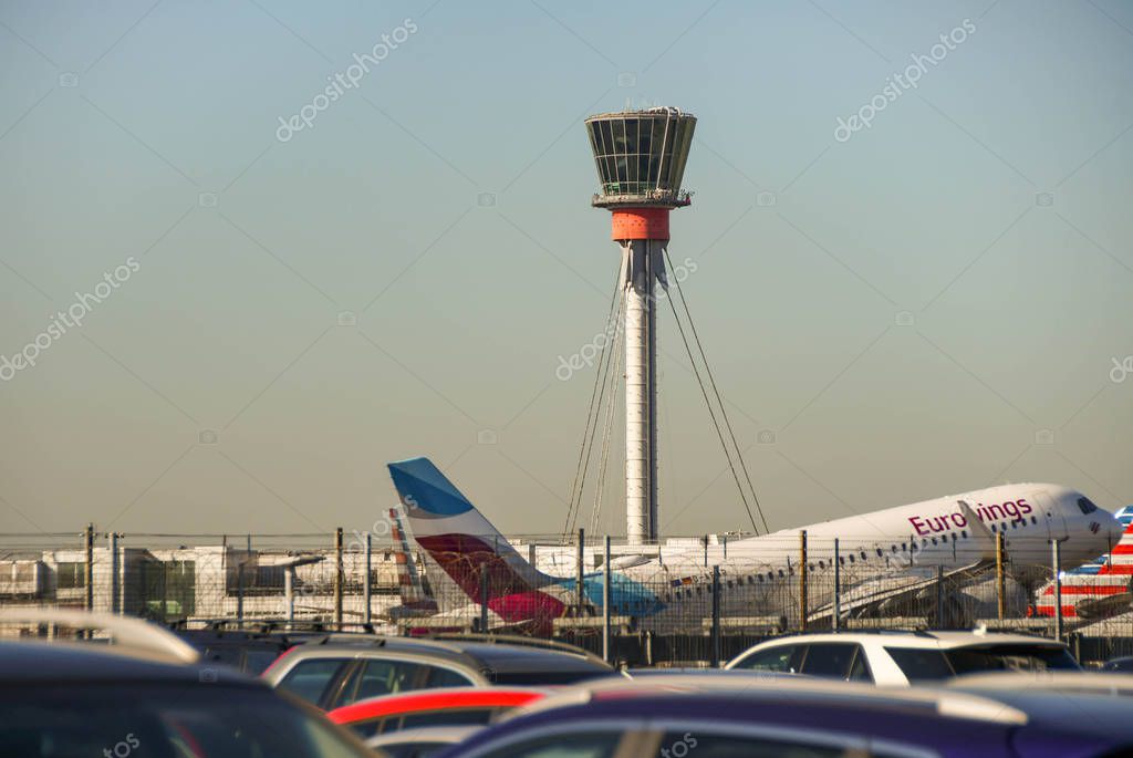 LONDON HEATHROW AIRPORT, ENGLAND - SEPTEMBER 2018: Eurowings jet taking off from London Heathrow Airport with the control tower in the background.