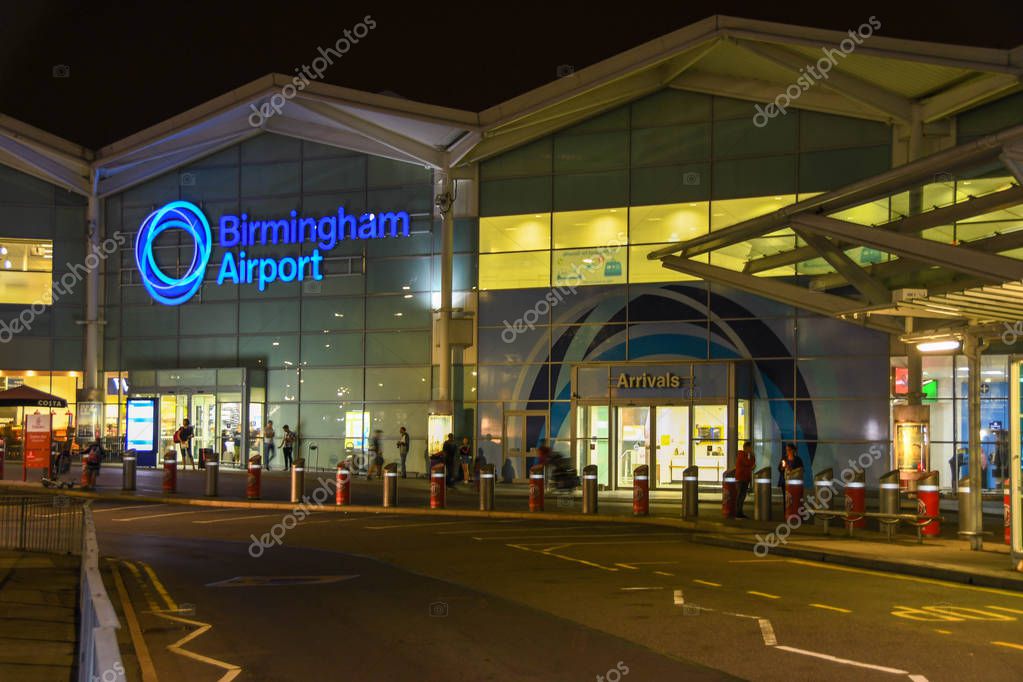 BIRMINGHAM INTERNATIONAL AIRPORT, ENGLAND - SEPTEMBER 2018: Illuminated sign on the outside of the terminal building at Birmingham International Airport.