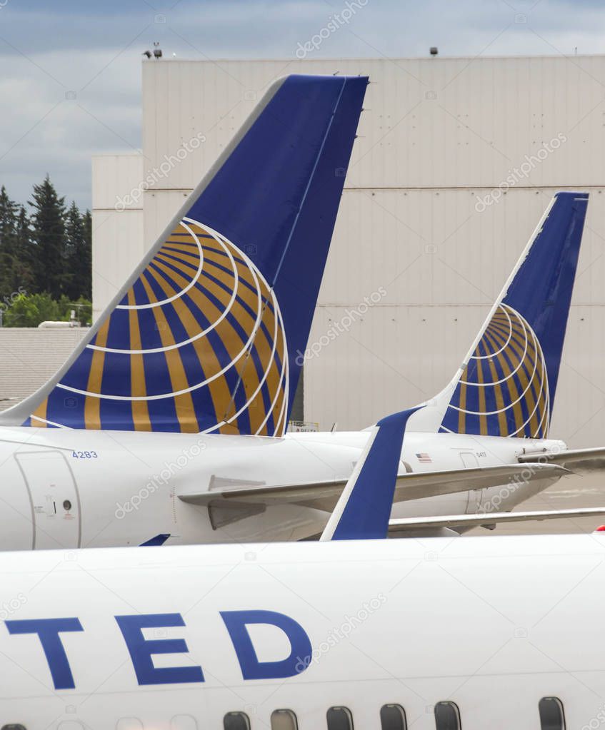 SEATTLE TACOMA AIRPORT, WA, USA - JUNE 2018: Close up of tail fins of United Airlines jets at Seattle Tacoma airport.