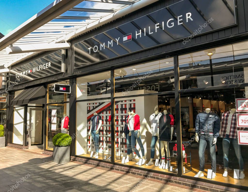BRIDGEND, WALES - MARCH 2019: Shop front of the branch of Tommy Hilfiger in the McArthur Glen outlet shopping mall in Bridgend.