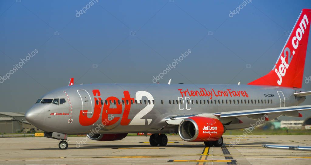 VERONA, ITALY - SEPTEMBER 2018: Tail fin of a Boeing 737 jet operated by UK-based Jet2 Airways taxiing to the terminal after arriving at Verona airport.