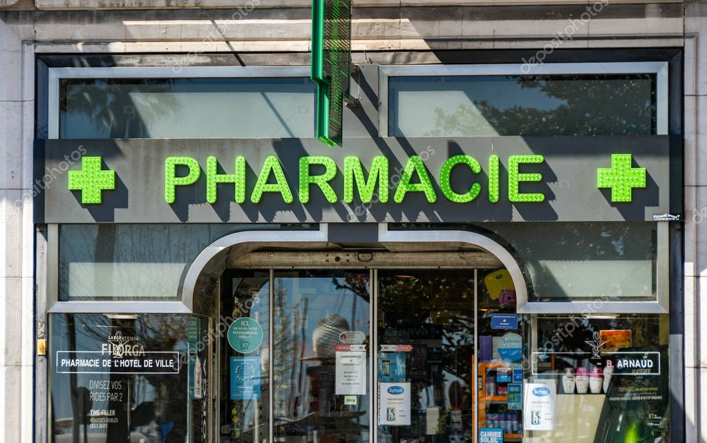 CANNES, FRANCE - APRIL 2019: Sign above the door of a pharmacy in Cannes.