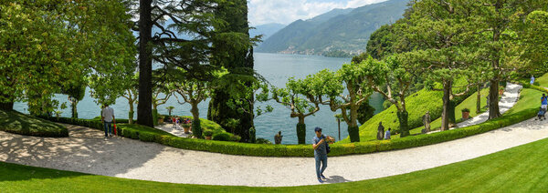 LENNO, LAKE COMO, ITALY - JUNE 2019: Panoramic view of the landscaped garden of the Villa Balbianello in Lenno on Lake Como.