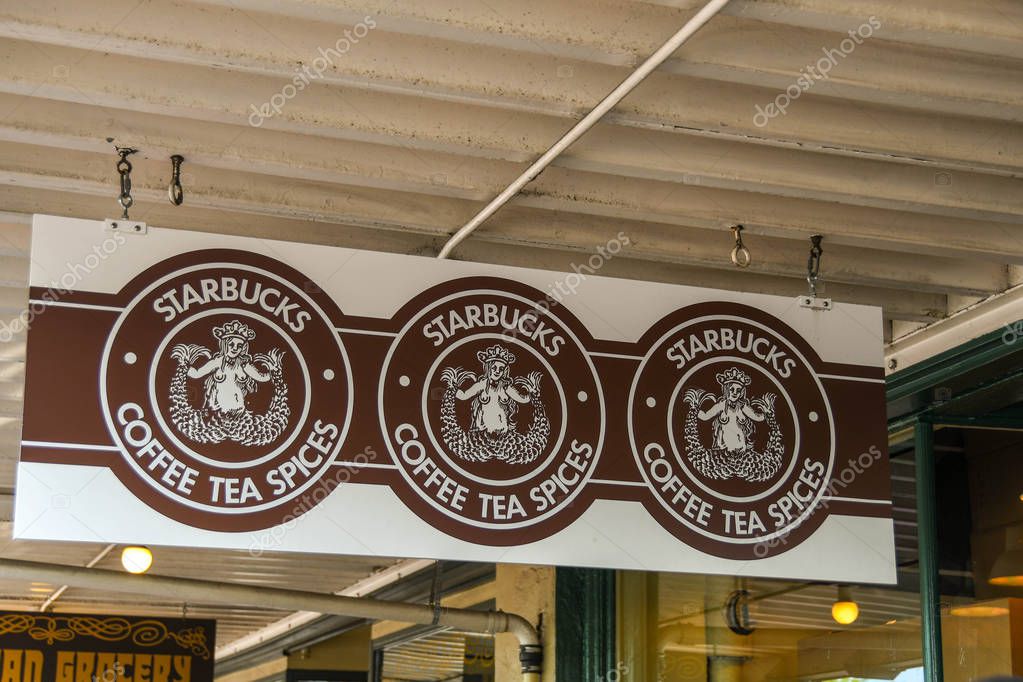 SEATTLE, WASHINGTON STATE, USA - JUNE 2018: Close up view of the sign hanging outside the original branch of Starbucks in Pike Place in Seattle city centre.