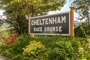 CHELTENHAM, ENGLAND - SEPTEMBER 2019: Sign on the platform of Cheltenham Racecourse Station on the Gloucestershire and Warwickshire Steam Railway. clipart