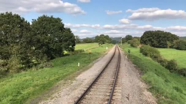 Single Railway Track Viewed Rear Coach Moving Train Passing Countryside — Stock Video