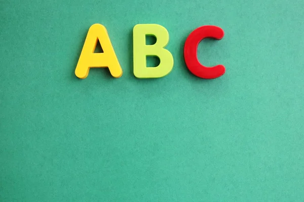 ABC first letter of the English alphabet on a green background. Empty space for text. Learning foreign language. — Stock Photo, Image