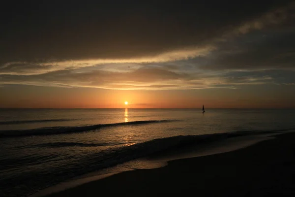 Sailboat at sunset off Captiva Island. — Stock Photo, Image