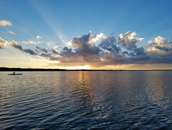 Distant kayakers on Coot Bay in Everglades National Park at sunset. — Stock Photo, Image