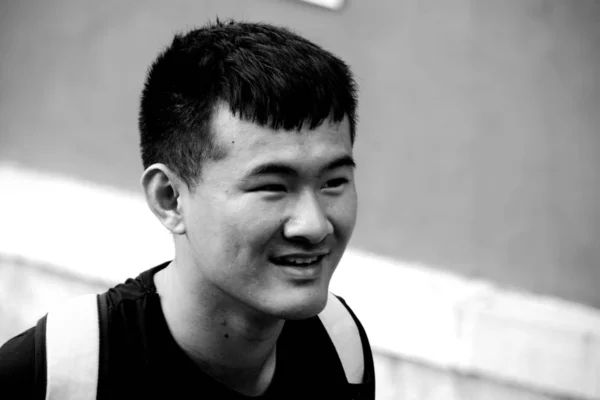 asian man in black and white