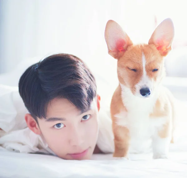 Portrait of stylish asian man with dog