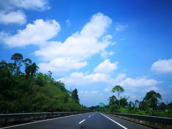 beautiful asphalt road in the blue sky