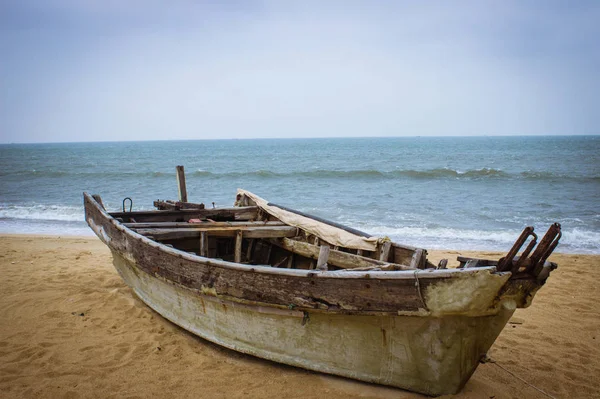 old wooden boat in the sea