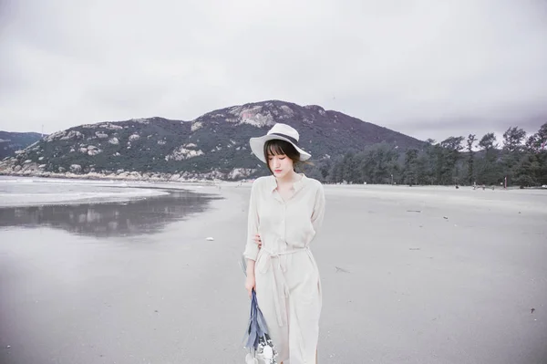 Beautiful woman walking near sea