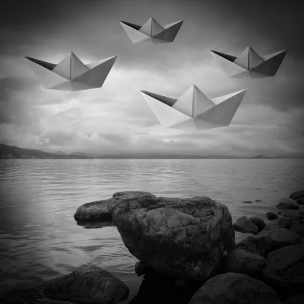 black and white paper boat on the sea