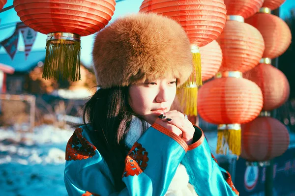 Girl in casual clothes with red Chinese lanterns