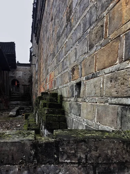 old brick wall in the city of the ruins of the ancient house