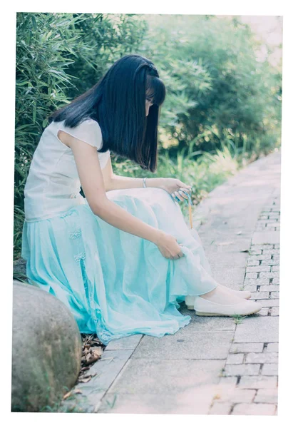 Girl in Chinese clothes in summer.