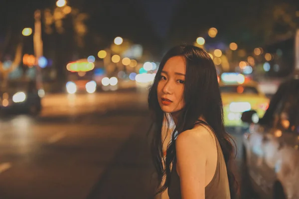 Portrait of asian woman at night