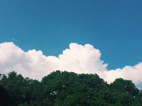 green sky with cloud and clouds