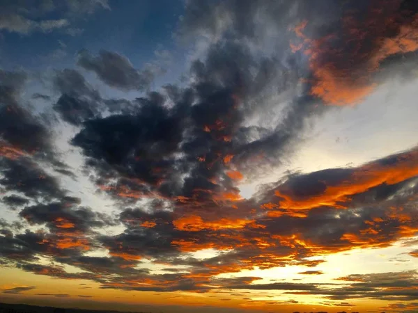 sunset in the sky with clouds