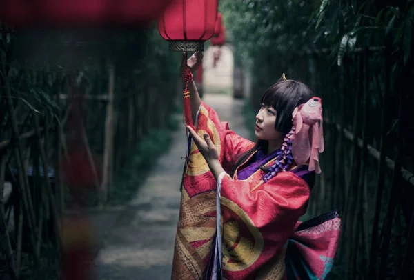 Beautiful Asian woman wearing kimono posing