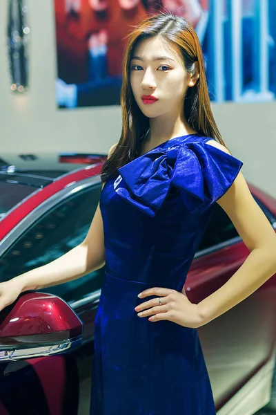 Portrait of female model on car festival