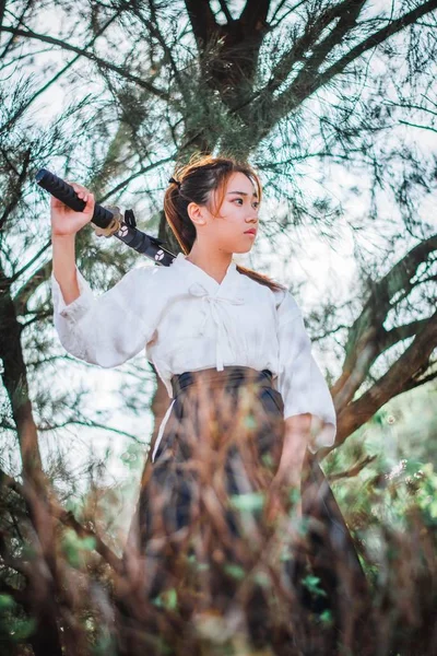 Asian woman holding the sword