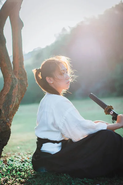 Asian woman holding the sword