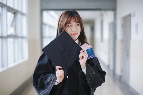 Asian female student posing in uniform