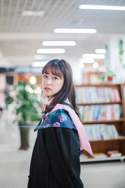 Asian female student posing in uniform