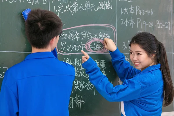 Asian schoolchildren during math lesson
